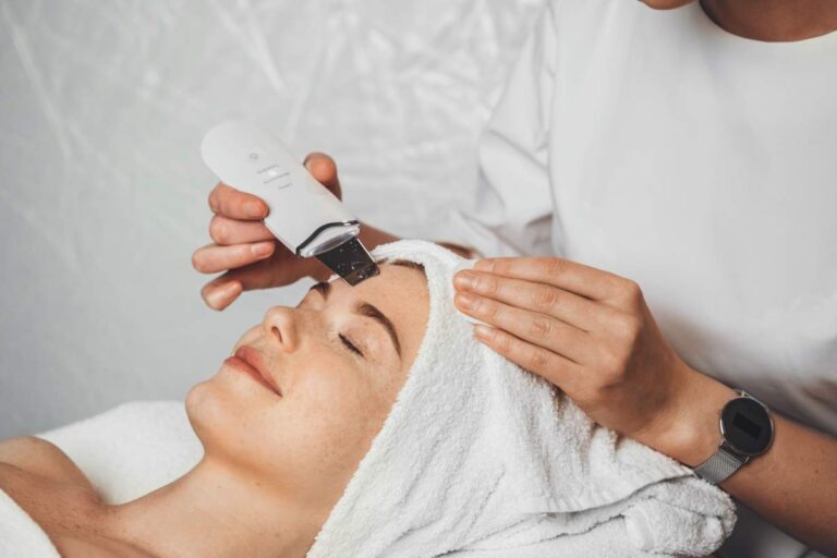 A woman examines the ingredients on a skincare product in a well-lit home bathroom.